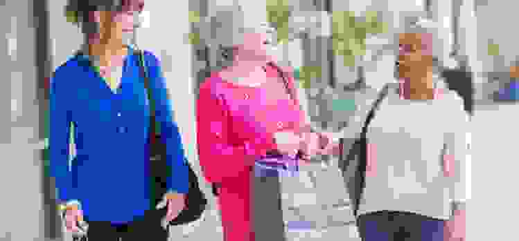 Three retired women shopping