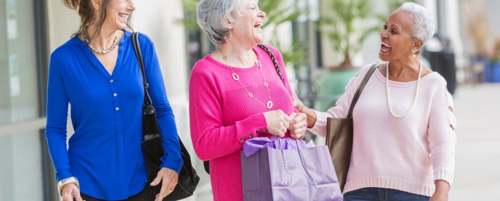 Three retired women shopping