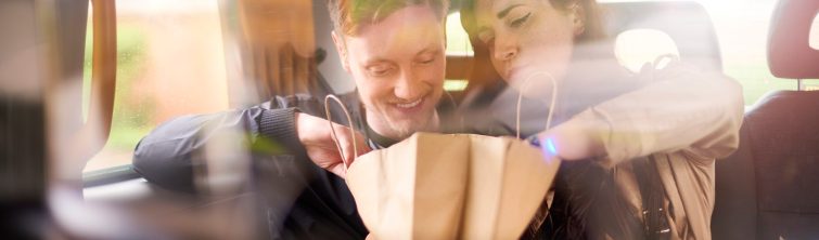 Couple looking in shopping bag