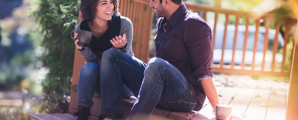 Couple discussing finances over coffee
