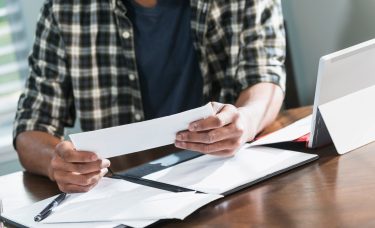 Man budgeting using the envelope method