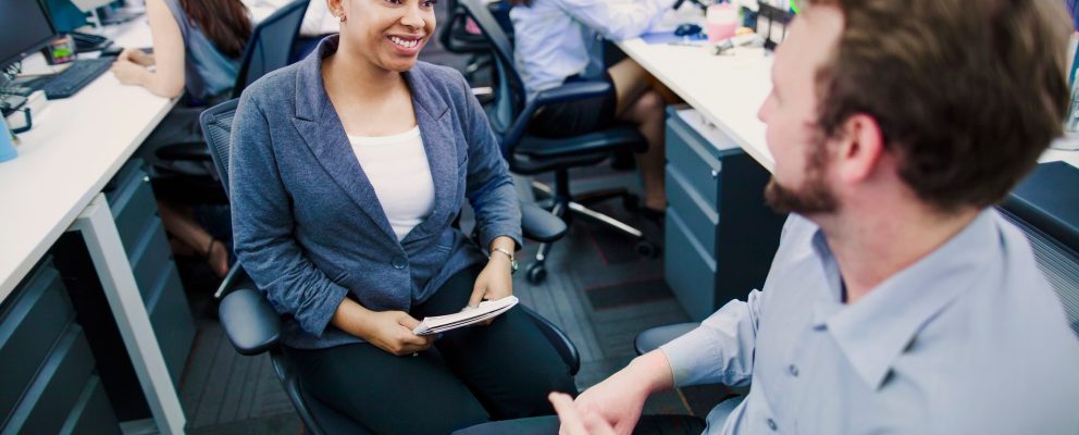 Woman getting to know her new coworkers on her first day