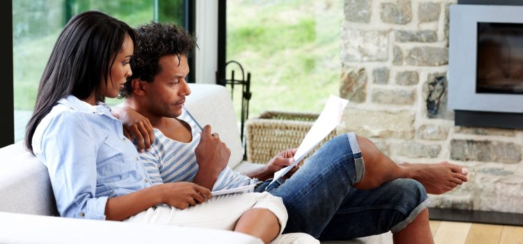 A man and woman review their budget.