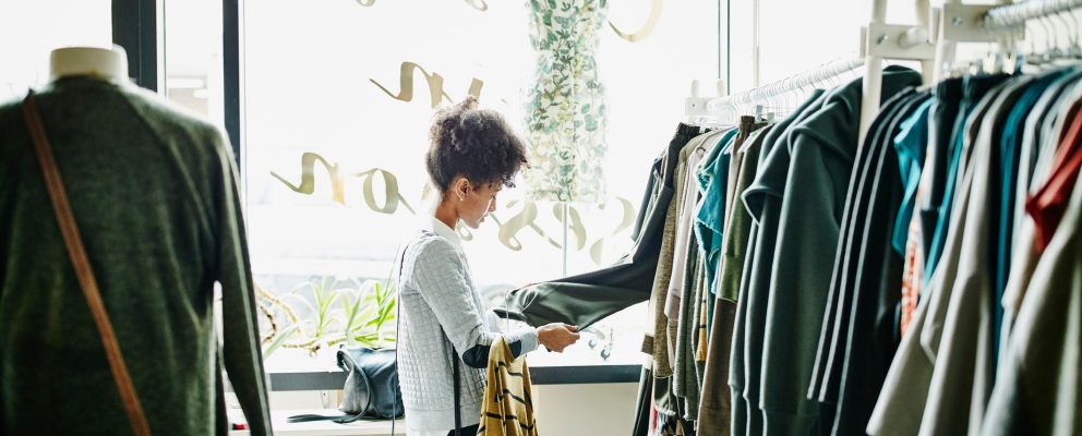 A woman shopping for clothes focuses on quality over quantity