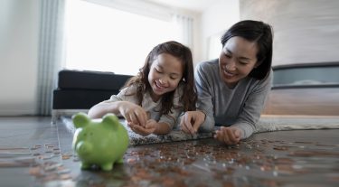 Mother and daughter counting change