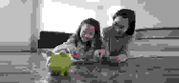 Mother and daughter counting change