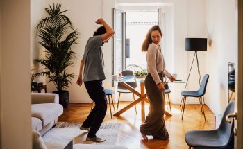 Couple dancing in their kitchen.
