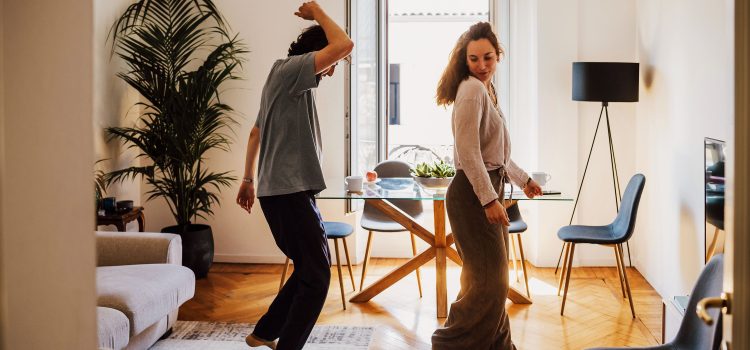 Couple dancing in their kitchen.