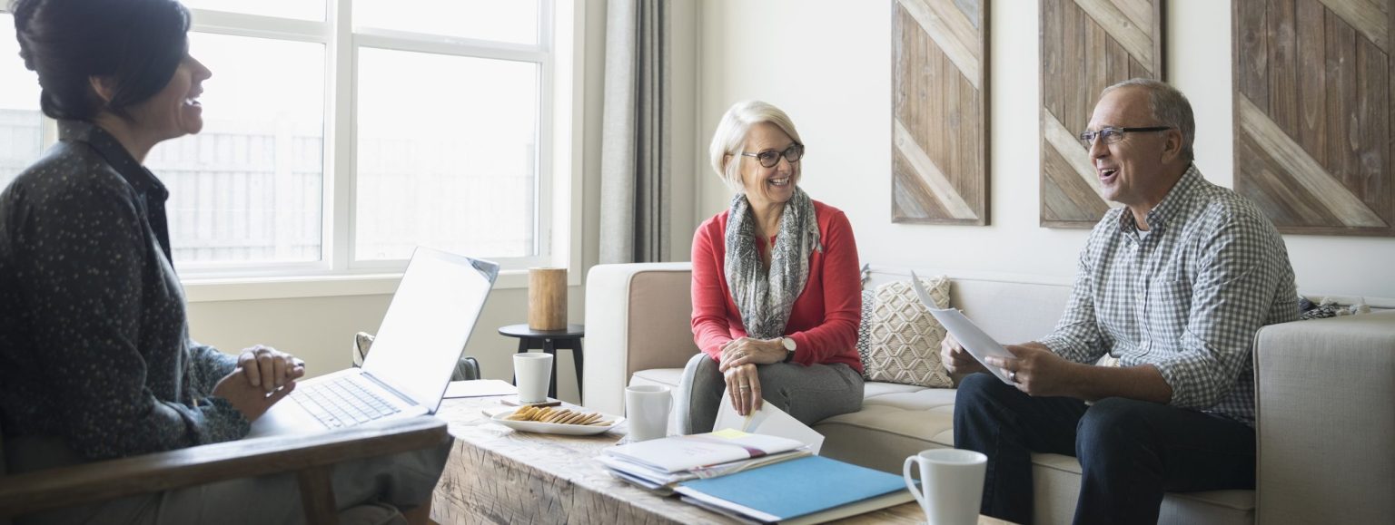 Retiring couple consulting with financial advisor