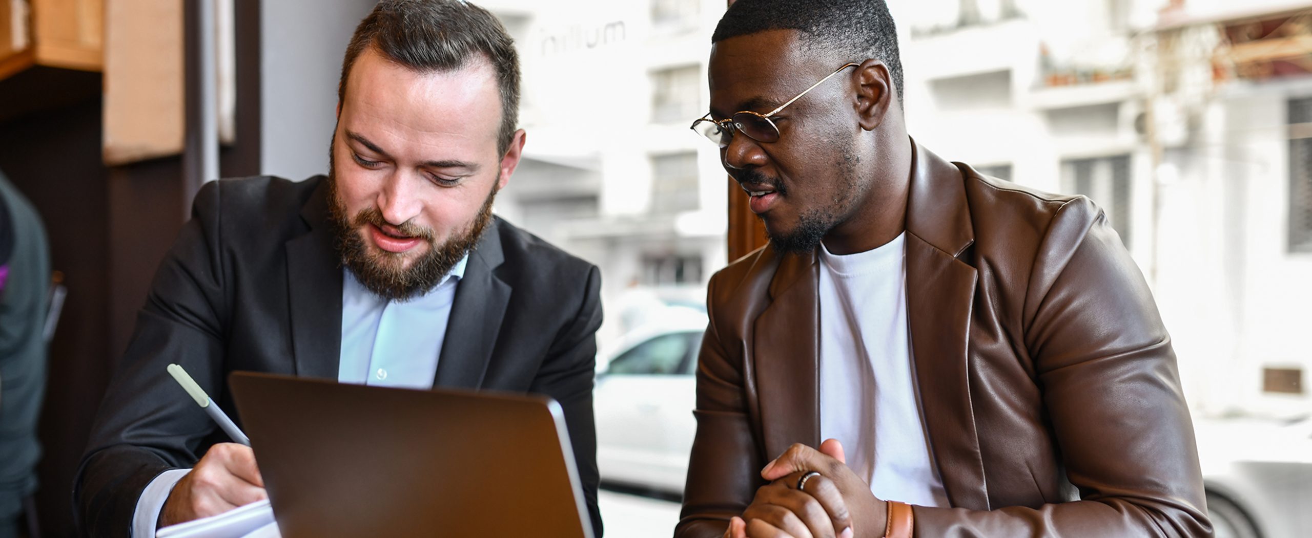 A man reviews documents with his financial advisor
